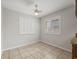 Well-lit room with neutral walls, neutral tile floor, and plantation shutters at 13050 110Th Ave, Largo, FL 33774