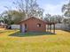 Outdoor shed featuring a covered carport area for storage, adding functionality to the backyard at 13050 110Th Ave, Largo, FL 33774