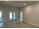 Open living area with access to back patio and bedroom at 13146 Kent Bradley St, Dade City, FL 33525