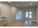 Spacious living area featuring wood-look tile floors at 13146 Kent Bradley St, Dade City, FL 33525