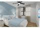 Guest bedroom with light blue walls, and a calming atmosphere at 14046 Gulf Blvd # 2, Madeira Beach, FL 33708