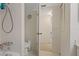 Functional bathroom with a tub, toilet, and view into an adjacent carpeted bedroom at 1450 Heather Ridge Blvd # 305, Dunedin, FL 34698