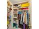 Well-organized closet with shelves and hanging rods at 1505 Mission Hills Blvd # 4D, Clearwater, FL 33759