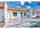 Condo exterior with a patio and blue chairs at 1505 Mission Hills Blvd # 4D, Clearwater, FL 33759