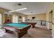 Well-equipped games room with pool table, ping pong, and exercise equipment at 1505 Mission Hills Blvd # 4D, Clearwater, FL 33759