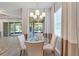 Breakfast nook with glass table and neutral colored chairs at 16028 Golden Lakes Dr, Wimauma, FL 33598