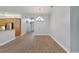 Formal dining area adjacent to the kitchen and hallway at 16028 Golden Lakes Dr, Wimauma, FL 33598