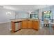 Kitchen island with granite countertop and stainless steel dishwasher at 16028 Golden Lakes Dr, Wimauma, FL 33598