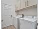 Convenient laundry room with washer and dryer at 16028 Golden Lakes Dr, Wimauma, FL 33598