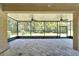 Large screened porch with ceiling fans and paver tile floor at 16028 Golden Lakes Dr, Wimauma, FL 33598