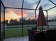 Screened patio with sunset view and backyard at 16942 Trite Bend St, Wimauma, FL 33598