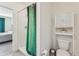 Bathroom with toilet, shower and linen cabinet at 16942 Trite Bend St, Wimauma, FL 33598