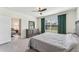 Bright bedroom with ensuite bathroom and access to a secondary room at 16942 Trite Bend St, Wimauma, FL 33598