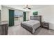 Spacious bedroom with large window and ensuite bathroom access at 16942 Trite Bend St, Wimauma, FL 33598