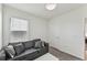 Bedroom with gray sofa and coffee table at 16942 Trite Bend St, Wimauma, FL 33598