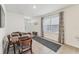 Bright dining room featuring a wooden table and chairs near an entryway at 16942 Trite Bend St, Wimauma, FL 33598