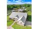 Estate featuring a large metal roof, backyard buildings, and scenic wooded surroundings at 1702 W Knights Griffin Rd, Plant City, FL 33565