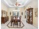 Elegant dining room with decorative details, decorative ceiling, and ample space at 1702 W Knights Griffin Rd, Plant City, FL 33565