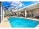 Sparkling pool with a screened lanai perfect for outdoor entertaining at 1702 W Knights Griffin Rd, Plant City, FL 33565