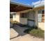 House exterior showcasing covered walkway and light-colored walls at 1819 Grand Blvd, Holiday, FL 34690