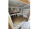 Retro kitchen with white cabinets and patterned tile floor at 1819 Grand Blvd, Holiday, FL 34690