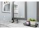 Close-up of a modern bathroom vanity with marble countertop, sleek faucet, and decorative accents at 18529 Otterwood Ave, Tampa, FL 33647