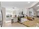 Bright kitchen featuring white cabinets, granite countertops, and stainless steel appliances and a sunny breakfast nook at 18529 Otterwood Ave, Tampa, FL 33647