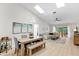 Bright living room with skylights, vaulted ceilings, and sliding glass doors to the backyard patio at 18529 Otterwood Ave, Tampa, FL 33647