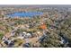 Wide aerial view of the property near a lake at 18615 Yocam Ave, Lutz, FL 33549