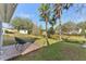 Spacious backyard with patio and lush landscaping at 18615 Yocam Ave, Lutz, FL 33549