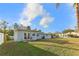 Spacious backyard with grassy lawn, providing ample outdoor space at 18615 Yocam Ave, Lutz, FL 33549