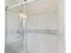 Modern bathroom with glass shower and marble tile at 18615 Yocam Ave, Lutz, FL 33549