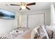 Bright bedroom with a comfortable bed and double door closet at 18615 Yocam Ave, Lutz, FL 33549