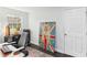 Home office with a large bulldog print and desk at 18615 Yocam Ave, Lutz, FL 33549