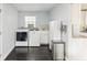 Laundry room with washer, dryer, and cabinets at 18615 Yocam Ave, Lutz, FL 33549