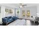 Bright living room with french doors leading to backyard at 18615 Yocam Ave, Lutz, FL 33549