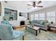 Cozy living room boasts a fireplace, large windows, and stylish decor at 212 S Himes Ave, Tampa, FL 33609