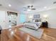 Bedroom with hardwood floors, a ceiling fan, and a neutral color scheme at 212 S Himes Ave, Tampa, FL 33609