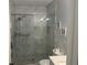 Updated bathroom with a walk-in shower and marble tile at 2263 Americus E Blvd # 59, Clearwater, FL 33763