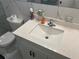 White vanity with a quartz countertop and sink at 2263 Americus E Blvd # 59, Clearwater, FL 33763