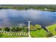 Kayaks and a dock on a calm lake at 2263 Americus E Blvd # 59, Clearwater, FL 33763