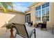 Peaceful patio featuring wicker furniture and potted plants at 2416 Kensington Greens Dr # 2416, Sun City Center, FL 33573