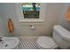 Bathroom with toilet, bidet, and black and white hexagon tile floor at 2418 2Nd S Ave, St Petersburg, FL 33712