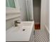 Modern bathroom with a white sink and updated faucet at 2418 2Nd S Ave, St Petersburg, FL 33712