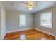 Bright bedroom with hardwood floors and ample natural light from two windows at 2418 2Nd S Ave, St Petersburg, FL 33712