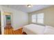 Charming bedroom with hardwood floors and view of hallway at 2418 2Nd S Ave, St Petersburg, FL 33712