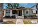 Charming bungalow with a green facade, porch, and well-maintained landscaping at 2418 2Nd S Ave, St Petersburg, FL 33712