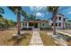 Front view of charming green house with walkway at 2418 2Nd S Ave, St Petersburg, FL 33712