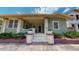 Front view of a charming green house with porch and steps at 2418 2Nd S Ave, St Petersburg, FL 33712