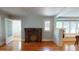 Living room with hardwood floors, brick fireplace, and French doors at 2418 2Nd S Ave, St Petersburg, FL 33712